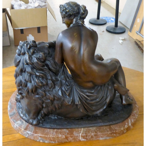 352 - After Willem Guillaume - 'Le Lion Amourex' a patinated bronze figure, seated beside a lion, on a mar... 