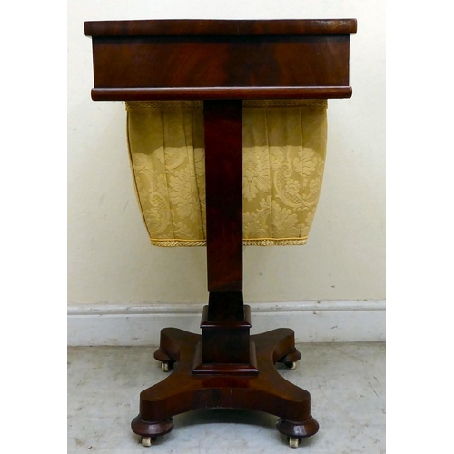 353 - A William IV mahogany work table, the top incorporating a compartmented frieze drawer, over a floral... 