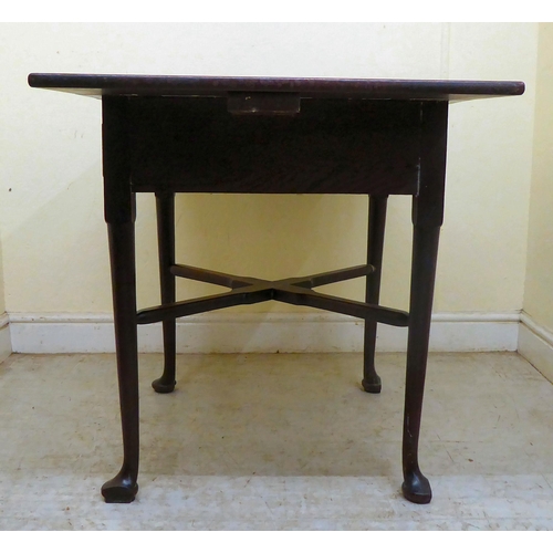 356 - A late Georgian oak Pembroke table with a frieze drawer and cast brass bail handles, raised on turne... 