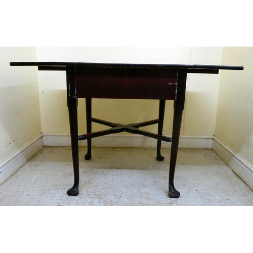 356 - A late Georgian oak Pembroke table with a frieze drawer and cast brass bail handles, raised on turne... 