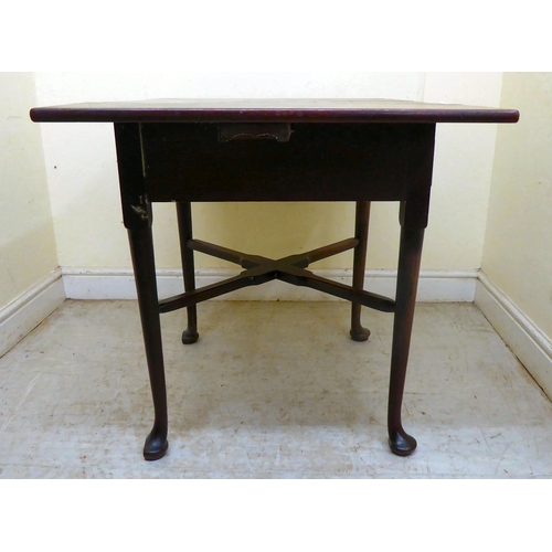 356 - A late Georgian oak Pembroke table with a frieze drawer and cast brass bail handles, raised on turne... 