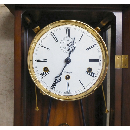 359 - A modern Kieninger mahogany cased Vienna regulator; the 8 day movement faced by an enamelled Roman d... 