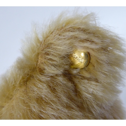 36 - A Herman Original golden plush covered mohair Teddy bear with a mobile head, limbs, a stitched nose ... 