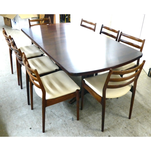 362 - A mid century France & Son rosewood extending dining table, raised on column uprights and splaye... 