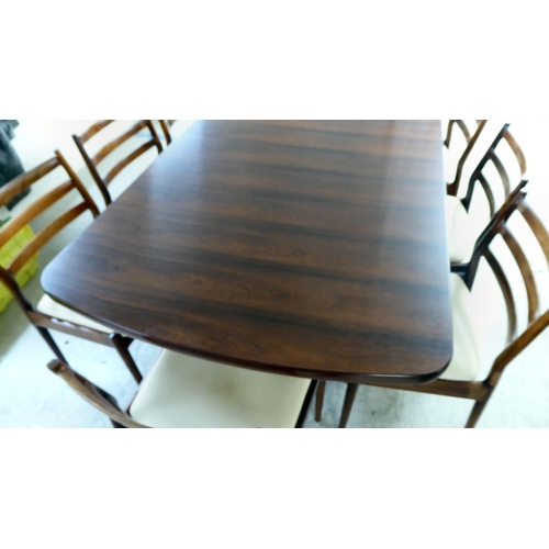 362 - A mid century France & Son rosewood extending dining table, raised on column uprights and splaye... 