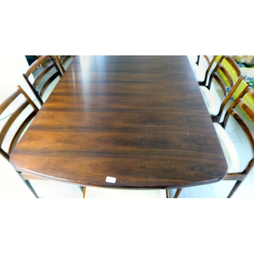 362 - A mid century France & Son rosewood extending dining table, raised on column uprights and splaye... 