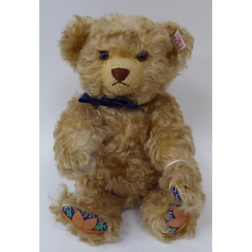 365 - The Royal Crown Derby Steiff dark blonde mohair Teddy bear with a mobile head and limbs, a stitched ... 