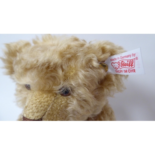 365 - The Royal Crown Derby Steiff dark blonde mohair Teddy bear with a mobile head and limbs, a stitched ... 