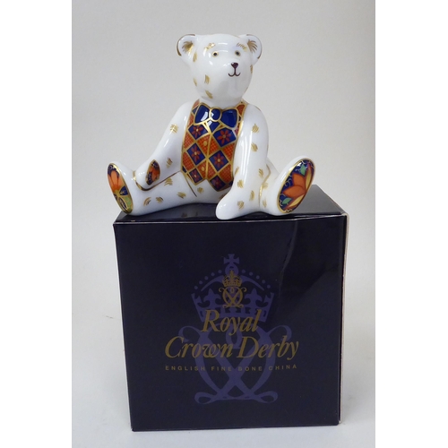 365 - The Royal Crown Derby Steiff dark blonde mohair Teddy bear with a mobile head and limbs, a stitched ... 