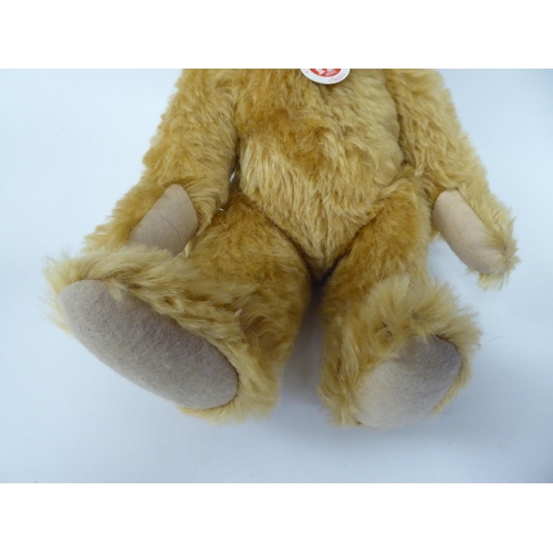 37 - A Steiff golden plush mohair covered Teddy bear with mobile limbs and a stitched nose  15