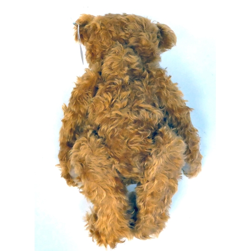 371 - A Steiff ginger coloured mohair Teddy bear with a mobile head and limbs, a stitched nose and growler... 