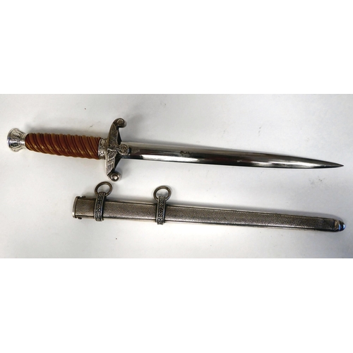 376 - A German Army officer's dagger with an orange coloured wrythen moulded grip and spreadeagle emblem, ... 