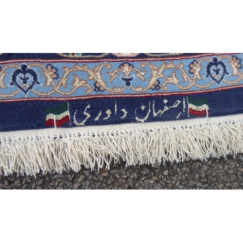 383 - A pair of Isfahan runners, each with a central pole medallion, on a red and blue ground  bears ... 