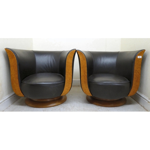 393 - A pair of modern Hotel le Malandre Model Depose maple veneered, tulip armchairs with wooden facings,... 