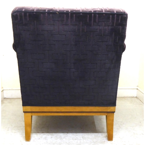 394 - A modern showwood maple veneered and inlaid Art Deco style club armchair with a low back and enclose... 