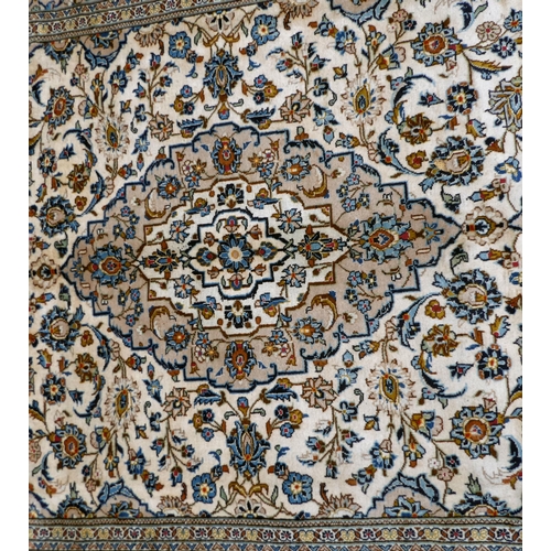 398 - An Iranian Keshan rug, decorated with repeating foliage designs, on a multi-coloured ground  82... 