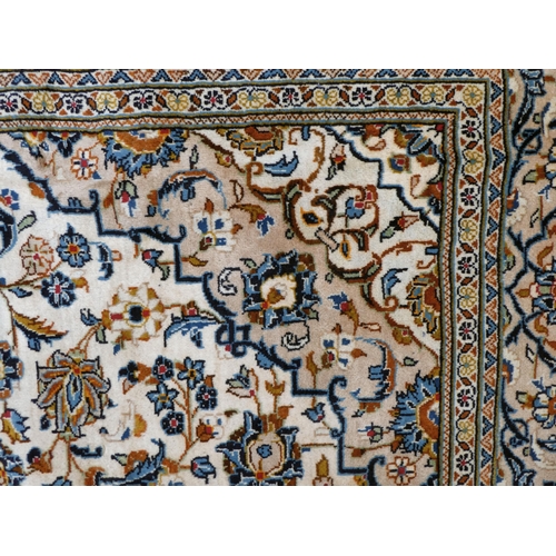 398 - An Iranian Keshan rug, decorated with repeating foliage designs, on a multi-coloured ground  82... 