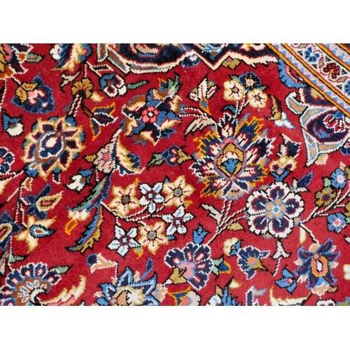 399 - An Iranian Keshan rug, decorated with repeating foliage designs, on a multi-coloured ground  80... 