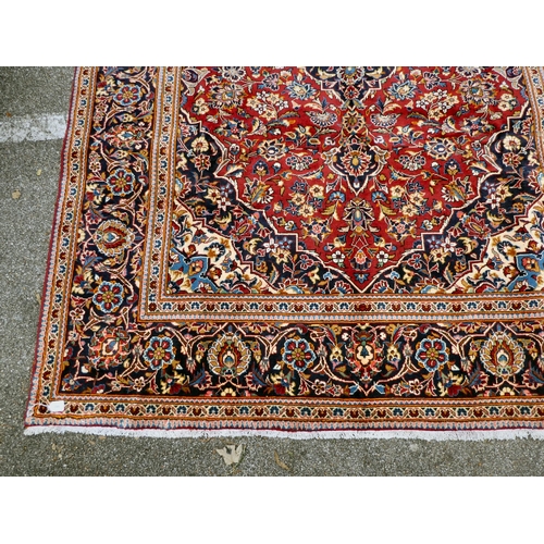 399 - An Iranian Keshan rug, decorated with repeating foliage designs, on a multi-coloured ground  80... 