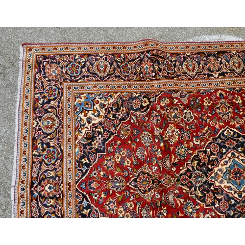 399 - An Iranian Keshan rug, decorated with repeating foliage designs, on a multi-coloured ground  80... 