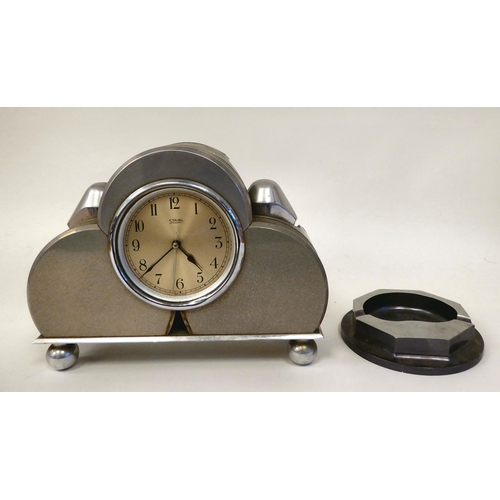 401 - A Sterling alloy cased mains electric mounted timepiece, manufactured from component parts as used i... 