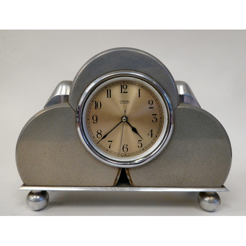 401 - A Sterling alloy cased mains electric mounted timepiece, manufactured from component parts as used i... 