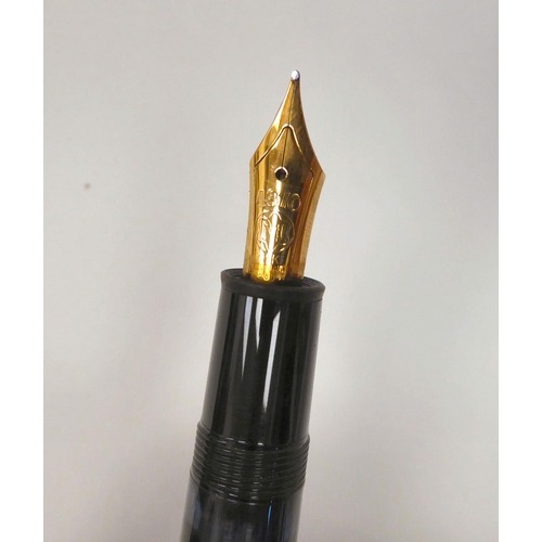 405 - A Mont Blanc fountain pen with a 14ct gold nib  stamped 810  boxed with guarantee for 1987