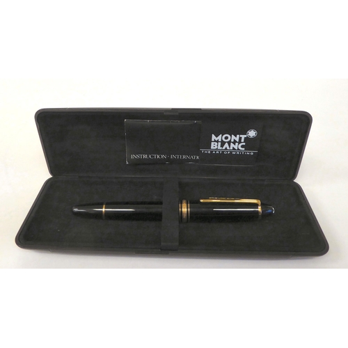 405 - A Mont Blanc fountain pen with a 14ct gold nib  stamped 810  boxed with guarantee for 1987