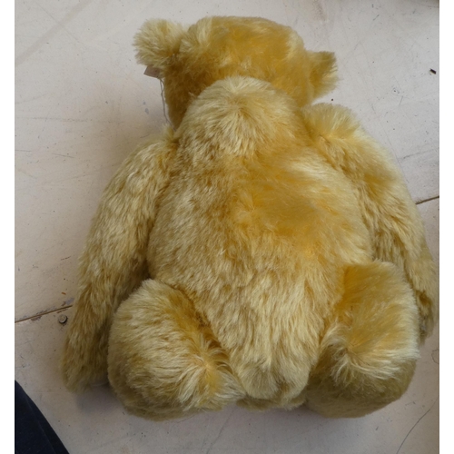 42 - A Steiff golden plush mohair covered Teddy bear with a mobile head, limbs, a stitched nose and a gro... 