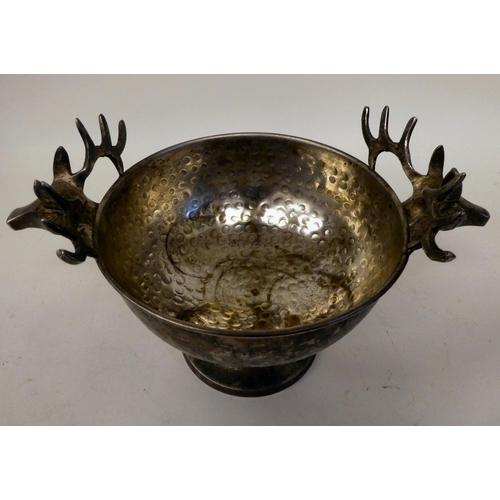 45 - A German white metal hunting trophy bowl with opposing stags head handles, on a pedestal base  9