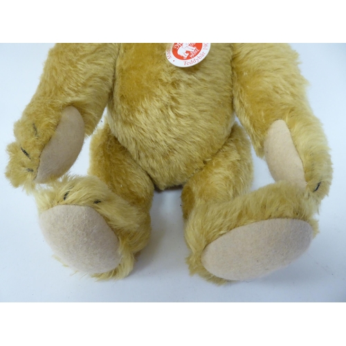 46 - A Steiff golden plush mohair covered Teddy bear with mobile limbs, stitched nose and a growler ... 