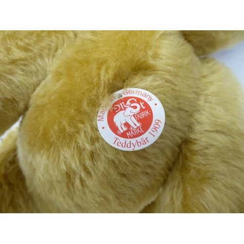 46 - A Steiff golden plush mohair covered Teddy bear with mobile limbs, stitched nose and a growler ... 