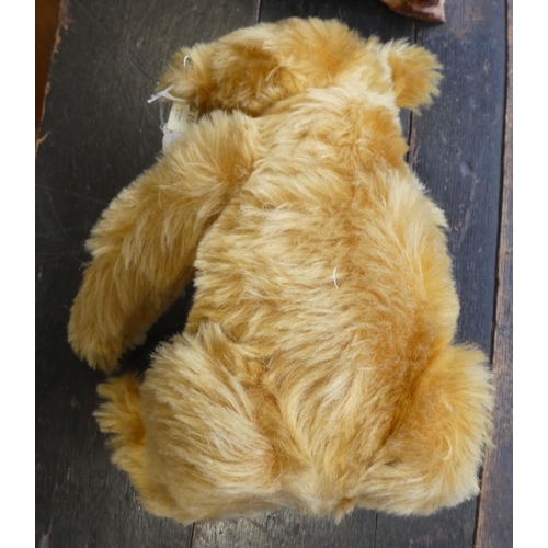 47 - A Steiff 1907 replica golden plush mohair covered Teddy bear with a mobile head, limbs, a stitched n... 