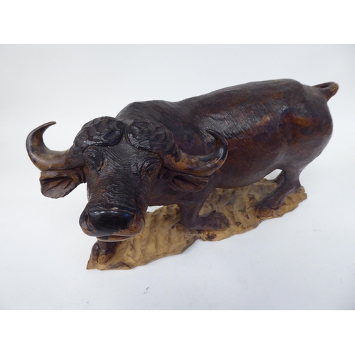 48 - A carved and stained hardwood model water buffalo  approx. 8