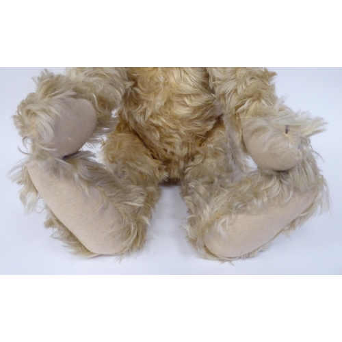 51 - A Steiff mahogany mohair covered Teddy bear with mobile limbs and a stitched nose  19