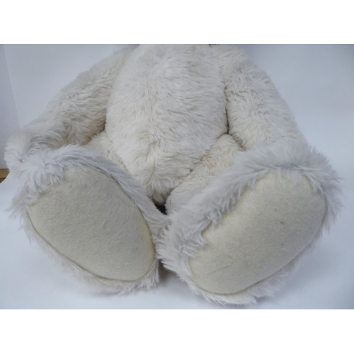 52 - A Steiff white mohair covered Teddy bear with a mobile head, limbs and a stitched nose  22