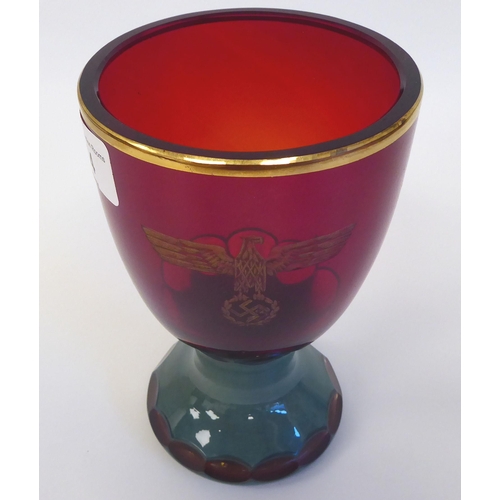 54 - A German Nazi red and green, ruby coloured and cut glass goblet  bearing an inscribed emblem(Pl... 