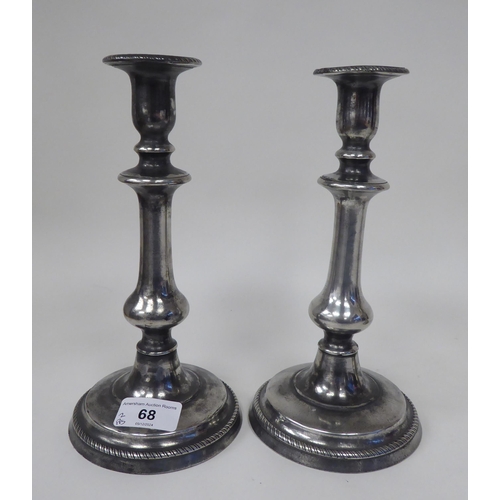 68 - Two pairs of similar 19thC pewter candlesticks, incorporating vase shape sockets, ring knopped and b... 