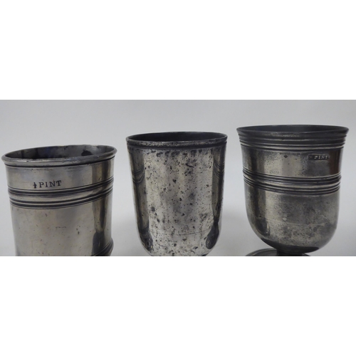 73 - Six 17th and 18thC pewter beakers of varying design: to include two of pedestal form