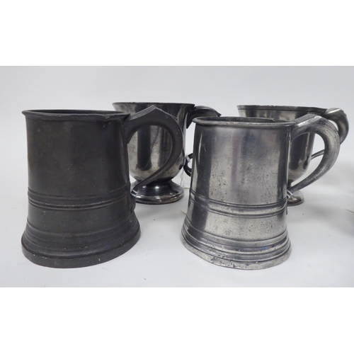 74 - Twelve various 18th/19thC pewter one pint (approx.) mugs of varying design