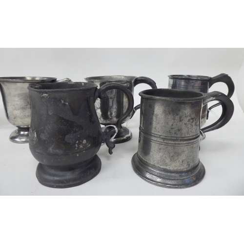 74 - Twelve various 18th/19thC pewter one pint (approx.) mugs of varying design