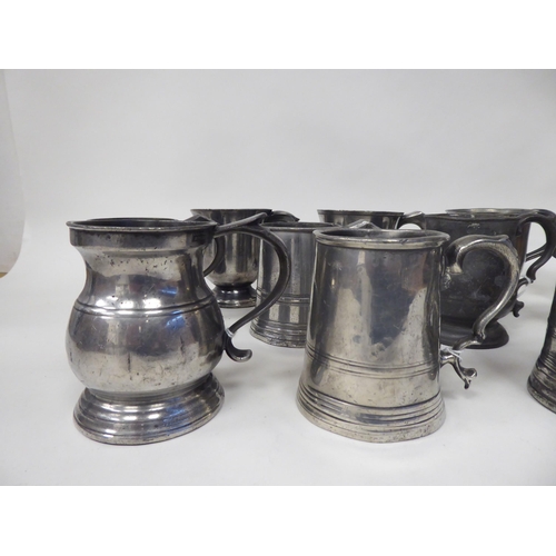 74 - Twelve various 18th/19thC pewter one pint (approx.) mugs of varying design