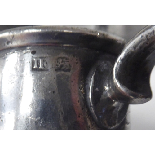 74 - Twelve various 18th/19thC pewter one pint (approx.) mugs of varying design