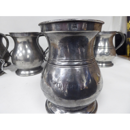 75 - Twelve similar 18th and 19thC pewter quart size (approx.) baluster shape mugs