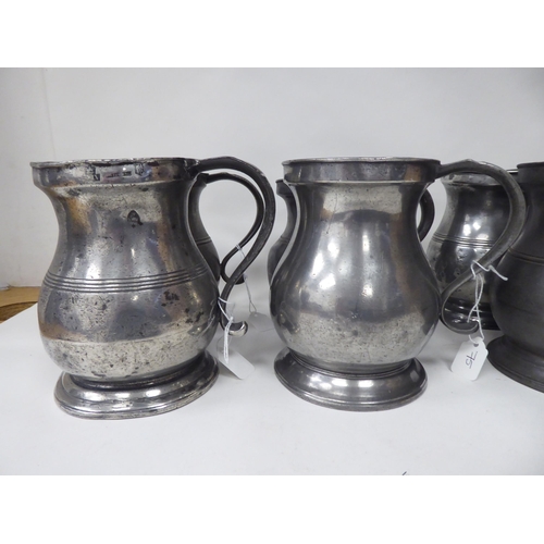 75 - Twelve similar 18th and 19thC pewter quart size (approx.) baluster shape mugs