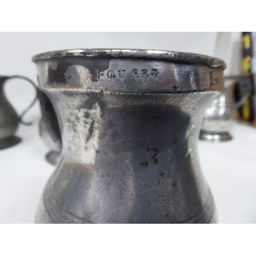 75 - Twelve similar 18th and 19thC pewter quart size (approx.) baluster shape mugs