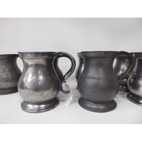 75 - Twelve similar 18th and 19thC pewter quart size (approx.) baluster shape mugs