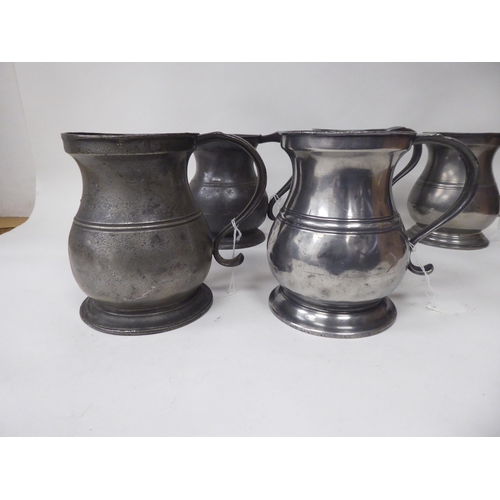 75 - Twelve similar 18th and 19thC pewter quart size (approx.) baluster shape mugs