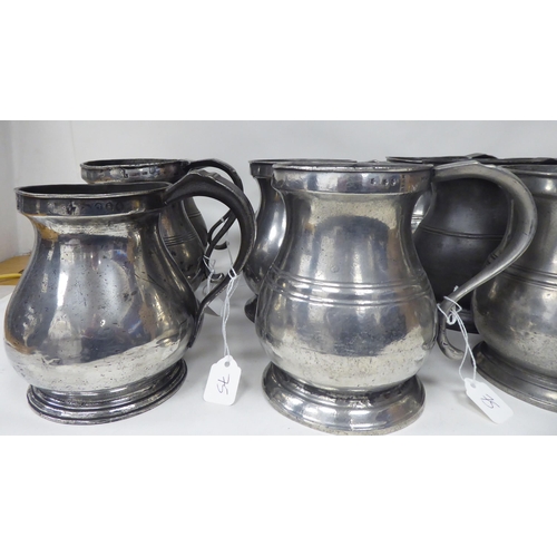 75 - Twelve similar 18th and 19thC pewter quart size (approx.) baluster shape mugs