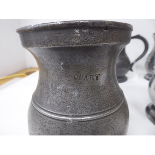 75 - Twelve similar 18th and 19thC pewter quart size (approx.) baluster shape mugs